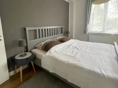 Ein Bett oder Betten in einem Zimmer der Unterkunft Fewo Grünstrand