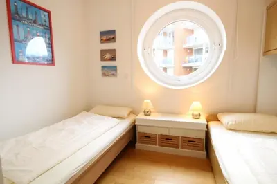 Ein Bett oder Betten in einem Zimmer der Unterkunft Strandpalais, Whg 05