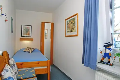 Ein Bett oder Betten in einem Zimmer der Unterkunft Haus Weisse Möwe, Whg 1