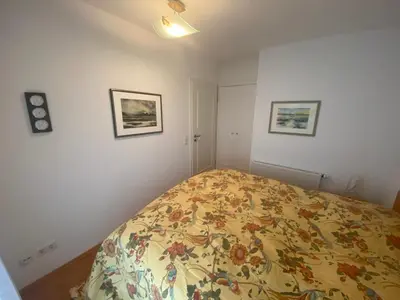 Ein Bett oder Betten in einem Zimmer der Unterkunft Dünenwind, Ferienwohnung 4