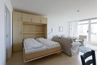 Ein Bett oder Betten in einem Zimmer der Unterkunft Panoramahaus Duhnen - Wohnung 31