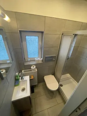 Ein Badezimmer in der Unterkunft Haus Seefalke - 250 m zum Meer