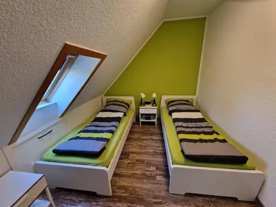 Ein Bett oder Betten in einem Zimmer der Unterkunft Ferienhaus Butendieksweg 99a