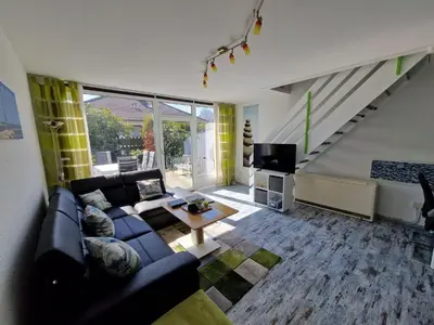 Ein Sitzbereich in der Unterkunft Ferienhaus Butendieksweg 99a