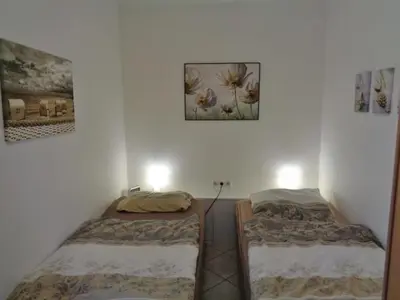 Ein Bett oder Betten in einem Zimmer der Unterkunft Haus Elisabeth, Whg 8