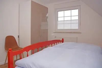 Ein Bett oder Betten in einem Zimmer der Unterkunft Haus Felix, Whg 7