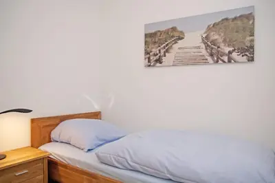 Ein Bett oder Betten in einem Zimmer der Unterkunft Haus Felix, Whg 7