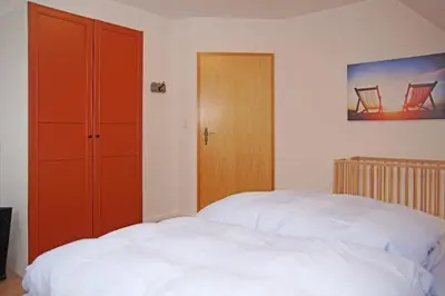 Ein Bett oder Betten in einem Zimmer der Unterkunft Haus Felix, Whg 7