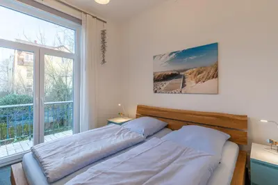 Ein Bett oder Betten in einem Zimmer der Unterkunft Haus Kapitäns Villa, Bugkajüte