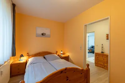 Ein Bett oder Betten in einem Zimmer der Unterkunft Haus Knechtsand, Whg 439