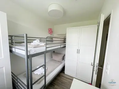 Ein Bett oder Betten in einem Zimmer der Unterkunft Haus Essen Duhnen Wohnung 10