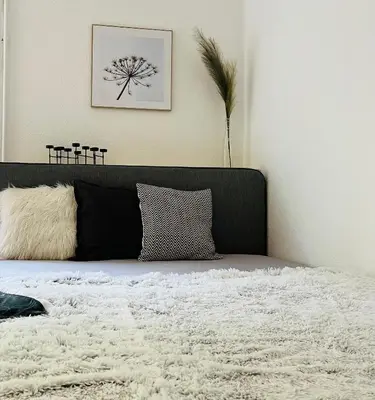 Ein Bett oder Betten in einem Zimmer der Unterkunft Deich Quartier 9.2