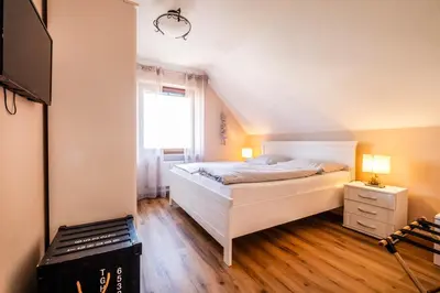 Ein Bett oder Betten in einem Zimmer der Unterkunft Haus Nordseeblick Wohnung 41