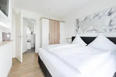 Ein Bett oder Betten in einem Zimmer der Unterkunft Haus Deichkieker Apartment 4 3 Deichgut