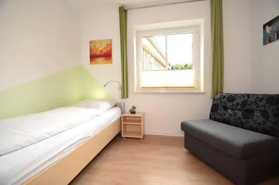 Ein Bett oder Betten in einem Zimmer der Unterkunft Haus Seehafen Apartment 0 1