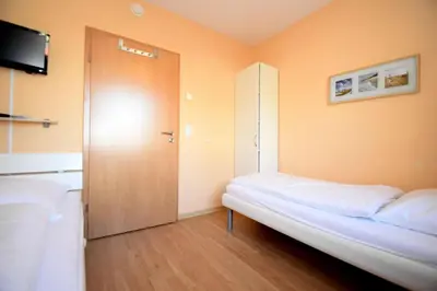 Ein Bett oder Betten in einem Zimmer der Unterkunft Haus Seehafen Apartment 1 1