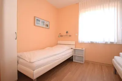 Ein Bett oder Betten in einem Zimmer der Unterkunft Haus Seehafen Apartment 1 1