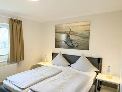 Ein Bett oder Betten in einem Zimmer der Unterkunft Haus Seewärts Wohnen Apartment 0 7