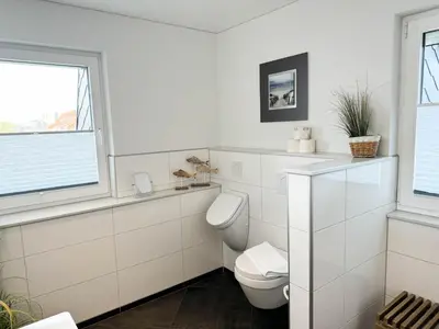 Ein Badezimmer in der Unterkunft Sand & Meer Penthouse-Apartment 5