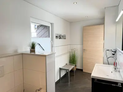 Ein Badezimmer in der Unterkunft Sand & Meer Penthouse-Apartment 5