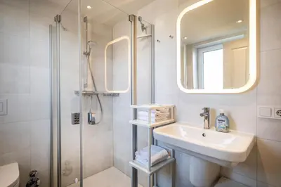Ein Badezimmer in der Unterkunft Haus Strandläufer Apartment 1 6 DeichLounge