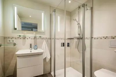 Ein Badezimmer in der Unterkunft Haus Strandläufer Apartment 2 6 Strandperle