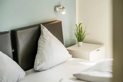 Ein Bett oder Betten in einem Zimmer der Unterkunft Haus Strandläufer Apartment 2 6 Strandperle