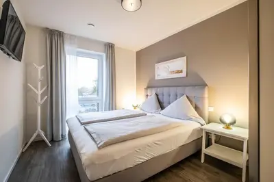 Ein Bett oder Betten in einem Zimmer der Unterkunft Haus Strandläufer Apartment 1 1 Meeresrauschen