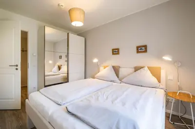 Ein Bett oder Betten in einem Zimmer der Unterkunft Haus Strandläufer Apartment 0 6