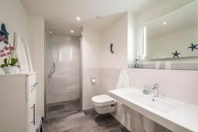 Ein Badezimmer in der Unterkunft Haus Strandläufer Apartment 1 4 Deichperle