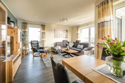 Ein Sitzbereich in der Unterkunft Haus Strandläufer Apartment 3 7 Wolkenkieker