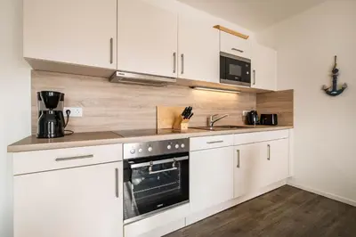 Küche/Küchenzeile in der Unterkunft Haus Strandläufer Apartment 2 2 Küstennebel