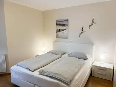 Ein Bett oder Betten in einem Zimmer der Unterkunft Haus Ankerplatz Apartment 2 2