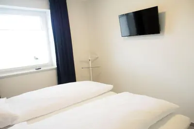 Ein Bett oder Betten in einem Zimmer der Unterkunft Haus Strandläufer Apartment 0 1 Strandburg