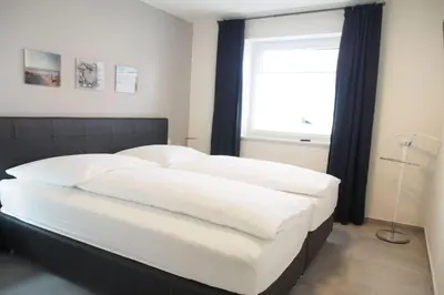 Ein Bett oder Betten in einem Zimmer der Unterkunft Haus Strandläufer Apartment 0 1 Strandburg