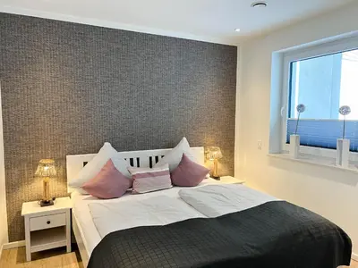 Ein Bett oder Betten in einem Zimmer der Unterkunft Haus Strandläufer Apartment 4 4 NordseeLounge