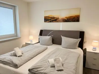 Ein Bett oder Betten in einem Zimmer der Unterkunft Haus Strandläufer Apartment 1 2 Oberdeck