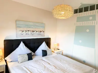 Ein Bett oder Betten in einem Zimmer der Unterkunft Haus Nordseeblick Wohnung 47 Möövnest 1