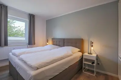 Ein Bett oder Betten in einem Zimmer der Unterkunft Haus Treibholz Apartment 5