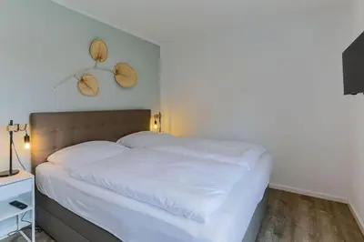 Ein Bett oder Betten in einem Zimmer der Unterkunft Haus Treibholz Apartment 8
