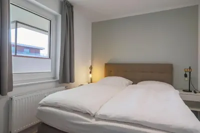 Ein Bett oder Betten in einem Zimmer der Unterkunft Haus Treibholz Apartment 10