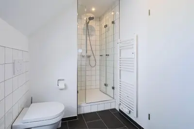 Ein Badezimmer in der Unterkunft Haus Treibholz Apartment 12