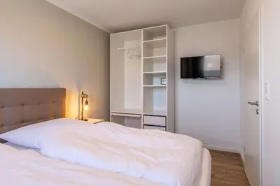 Ein Bett oder Betten in einem Zimmer der Unterkunft Haus Treibholz Apartment 11