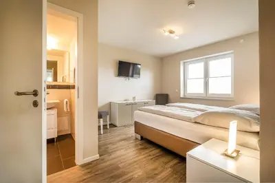 Ein Bett oder Betten in einem Zimmer der Unterkunft Haus Deichoase Apartment 1 5