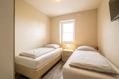 Ein Bett oder Betten in einem Zimmer der Unterkunft Haus Deichoase Apartment 1 5