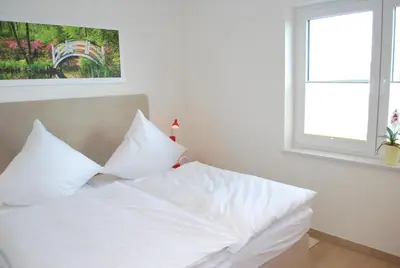 Ein Bett oder Betten in einem Zimmer der Unterkunft Haus Deichoase Apartment 3 1