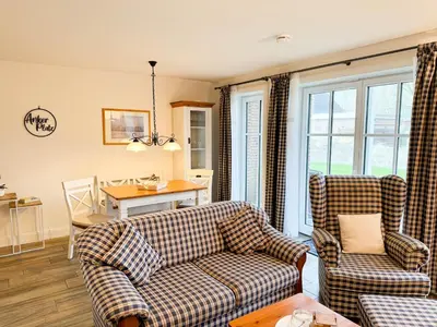 Ein Sitzbereich in der Unterkunft Büsumer Reethus Apartment 1 4