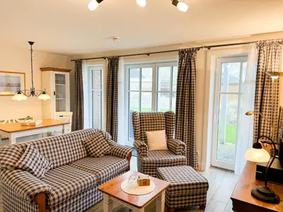 Ein Sitzbereich in der Unterkunft Büsumer Reethus Apartment 1 4