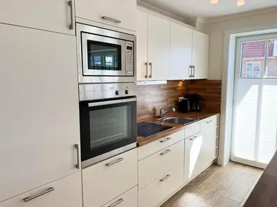 Küche/Küchenzeile in der Unterkunft Büsumer Reethus Apartment 2 6