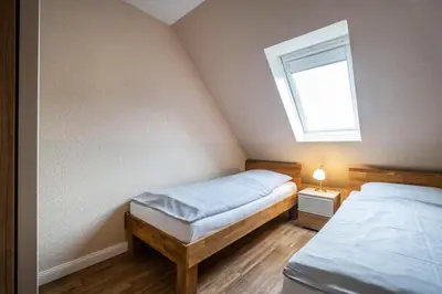 Ein Bett oder Betten in einem Zimmer der Unterkunft Haus Kähler 2 Wohnung 10